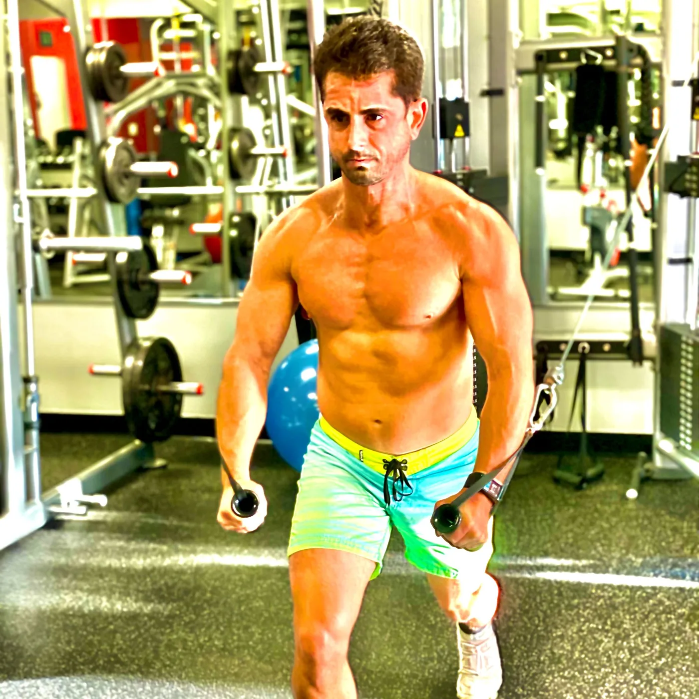 Coach Gui training on the cable machine